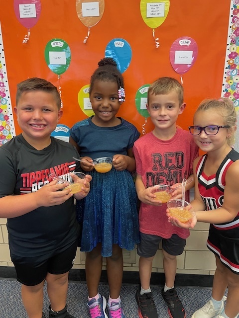 First graders made applesauce to celebrate Johnny Appleseed's birthday.