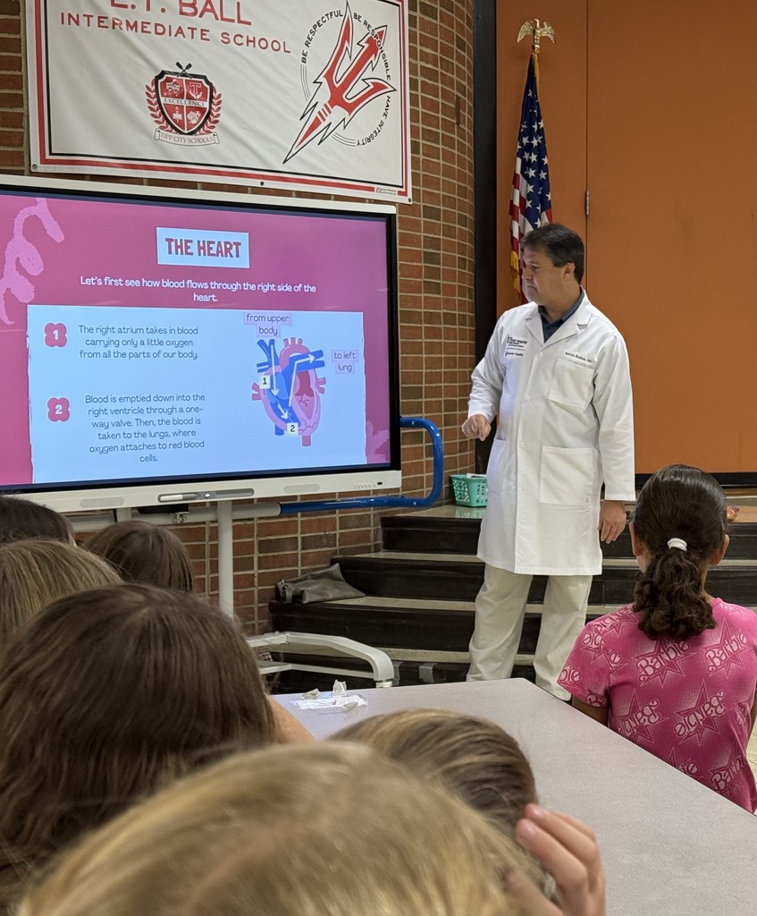 Students learn about the heart from a cardiologist.  