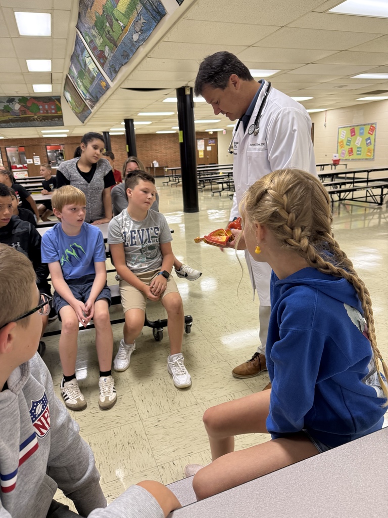 Students learn about the heart from a cardiologist.  