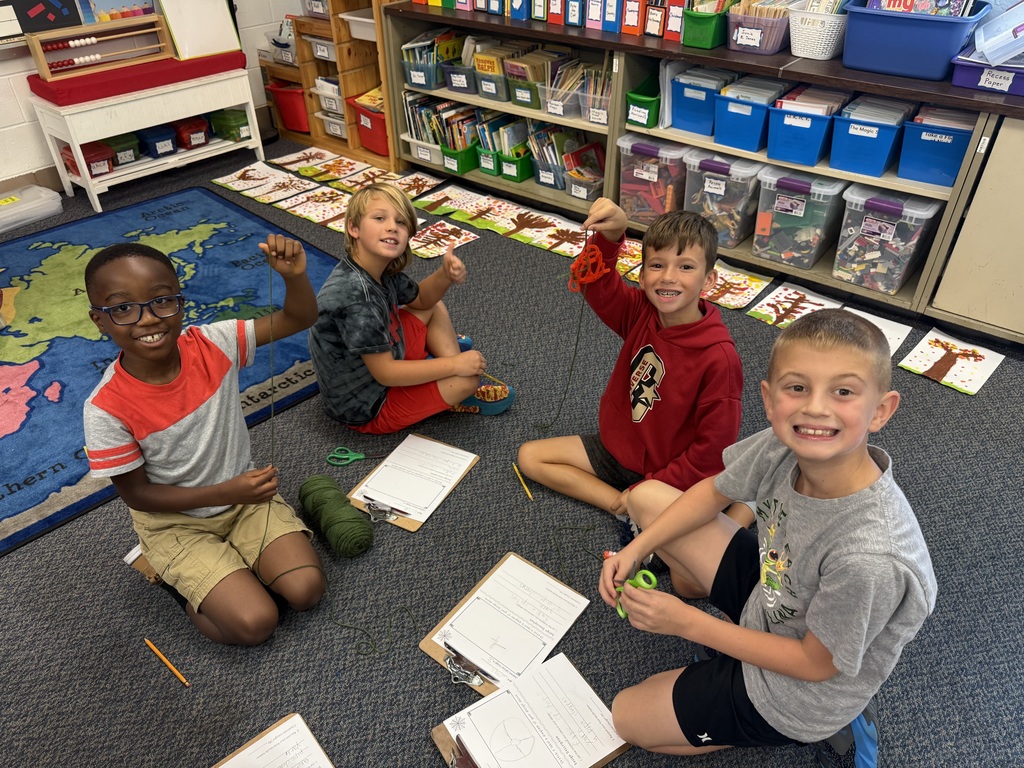Students creating web catchers.