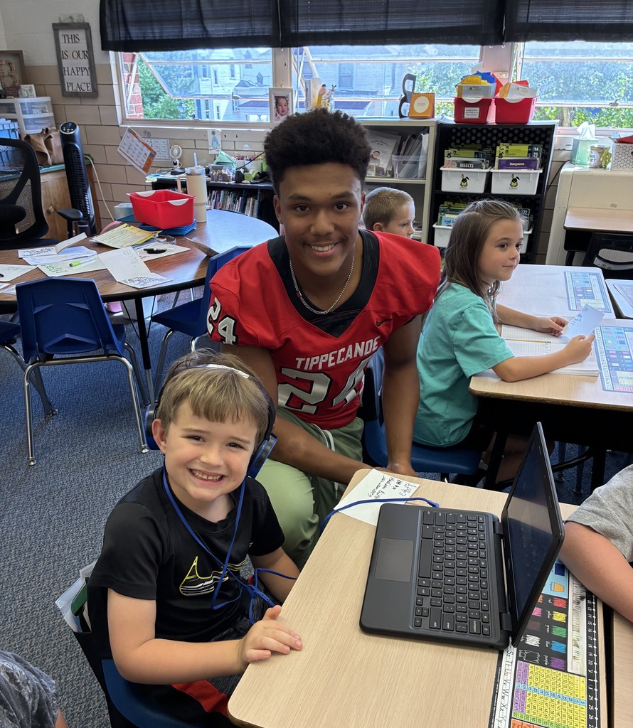 THS varsity football players and cheerleaders visit Broadway students.