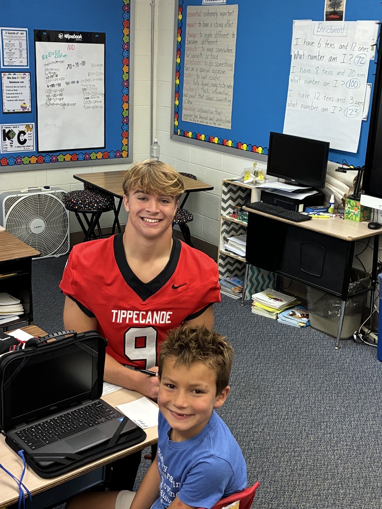 THS varsity football players and cheerleaders visit Broadway students.