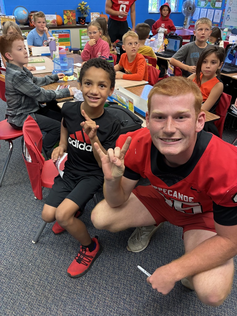 THS varsity football players and cheerleaders visit Broadway students.