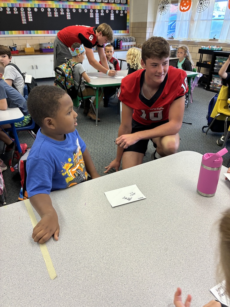 THS varsity football players and cheerleaders visit Broadway students.
