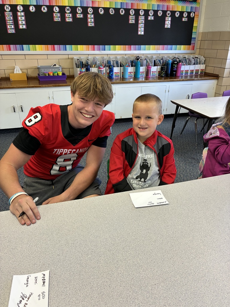THS varsity football players and cheerleaders visit Broadway students.