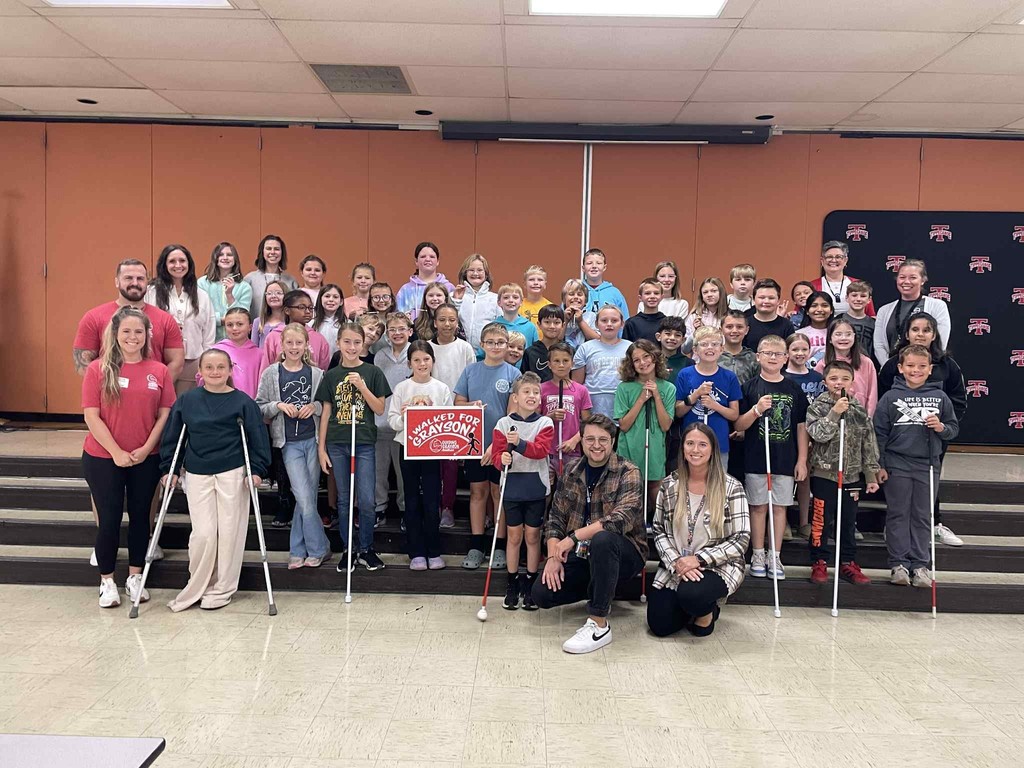 Grayson and his classmates pose for a photo.