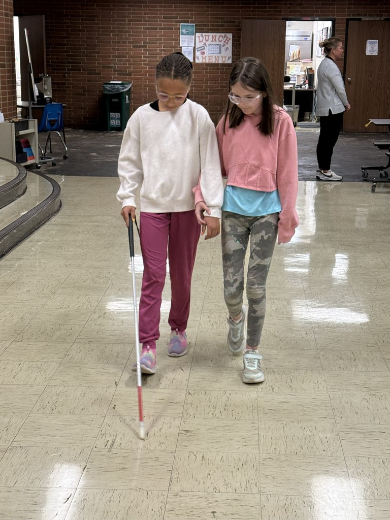Students practice using a white cane.  
