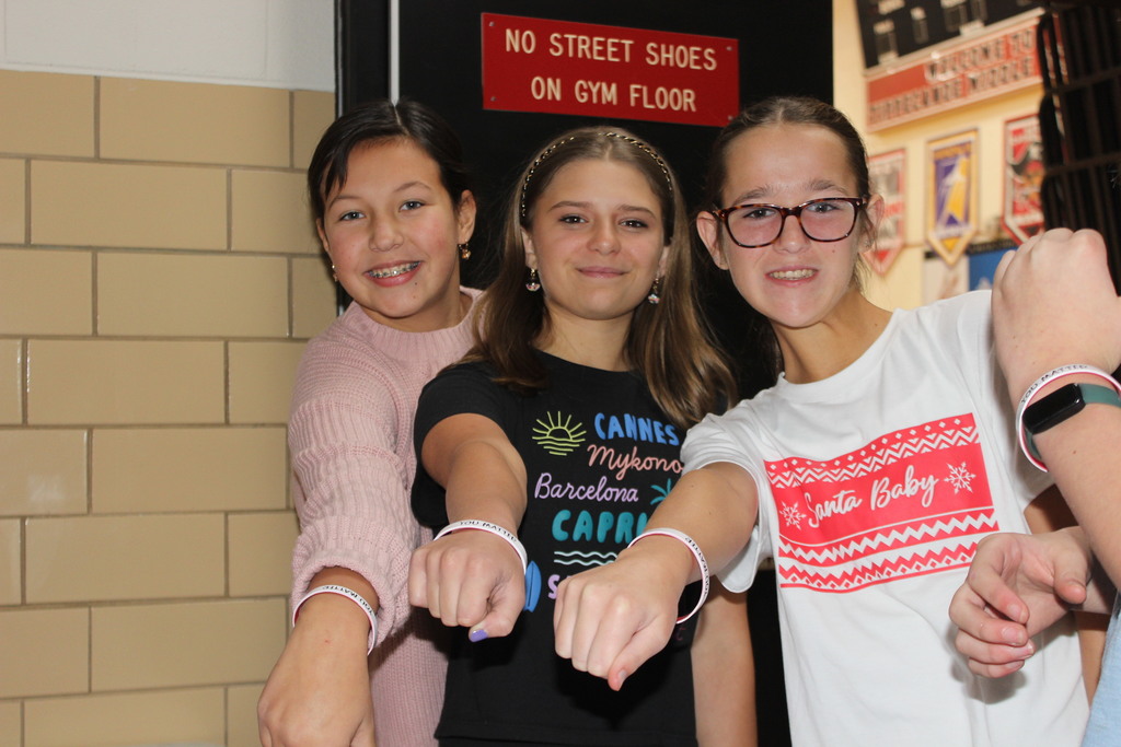 TMS students show off their bracelets.