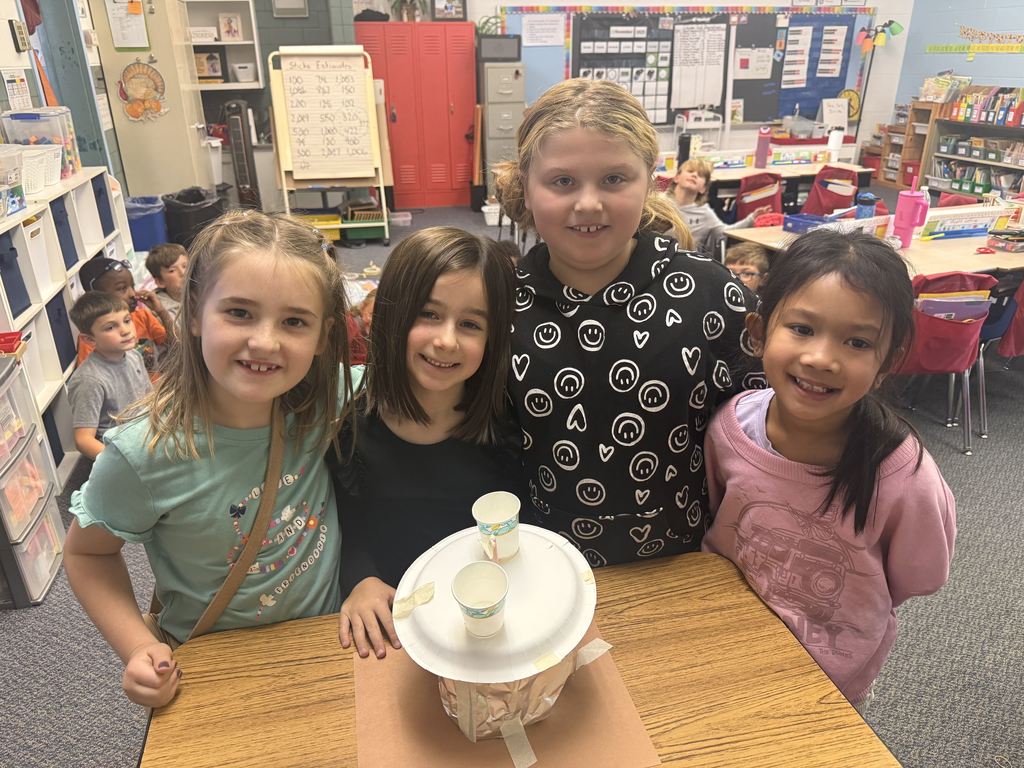 Broadway students learn about the strugglers of early settlers and pose with their project. 