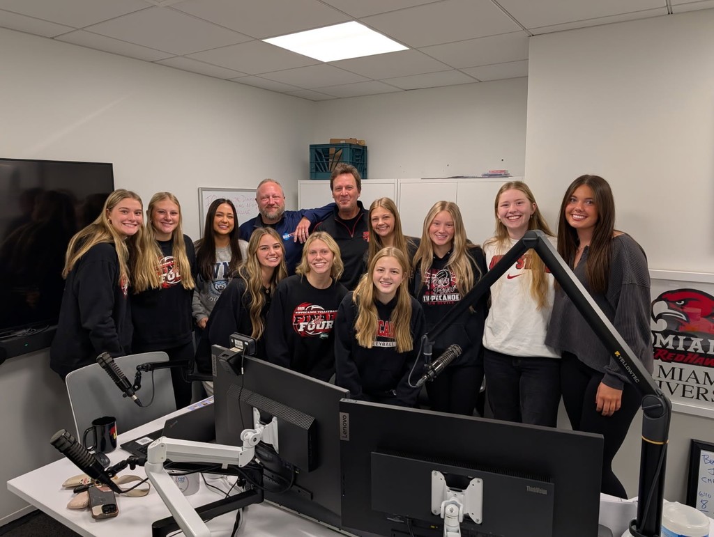 Volleyball team at Mix 107.7 being interviewed as the State Champs.