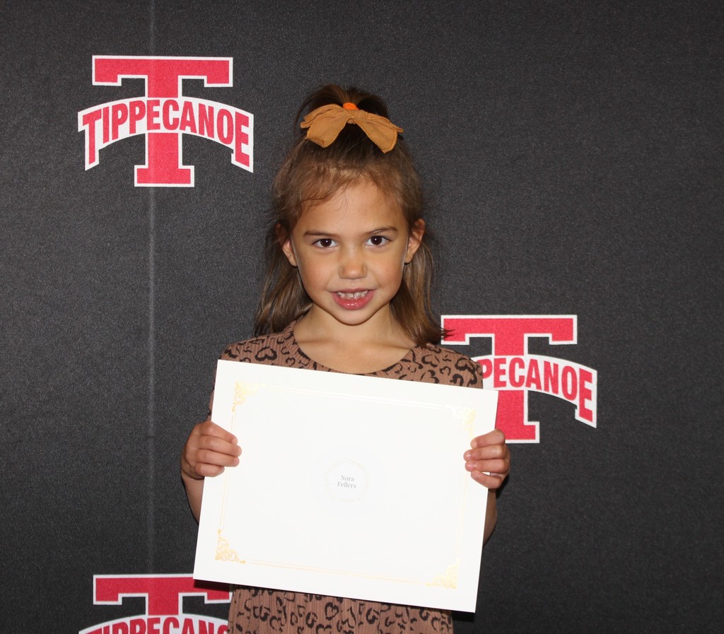 First grader honored at BOE meeting with the Perseverance Award.