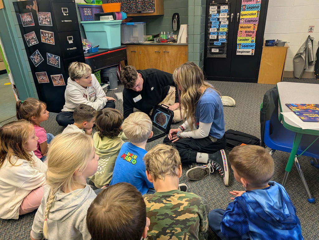 TMS 8th graders work with kindergarten students to learn about holiday traditions around the world. 