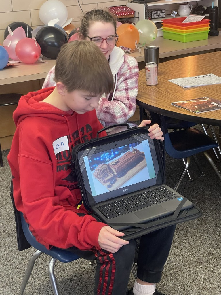 TMS 8th graders work with kindergarten students to learn about holiday traditions around the world. 