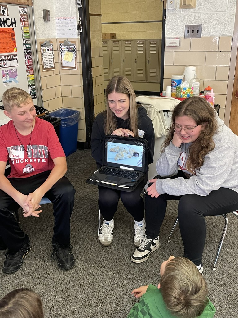 TMS 8th graders work with kindergarten students to learn about holiday traditions around the world. 