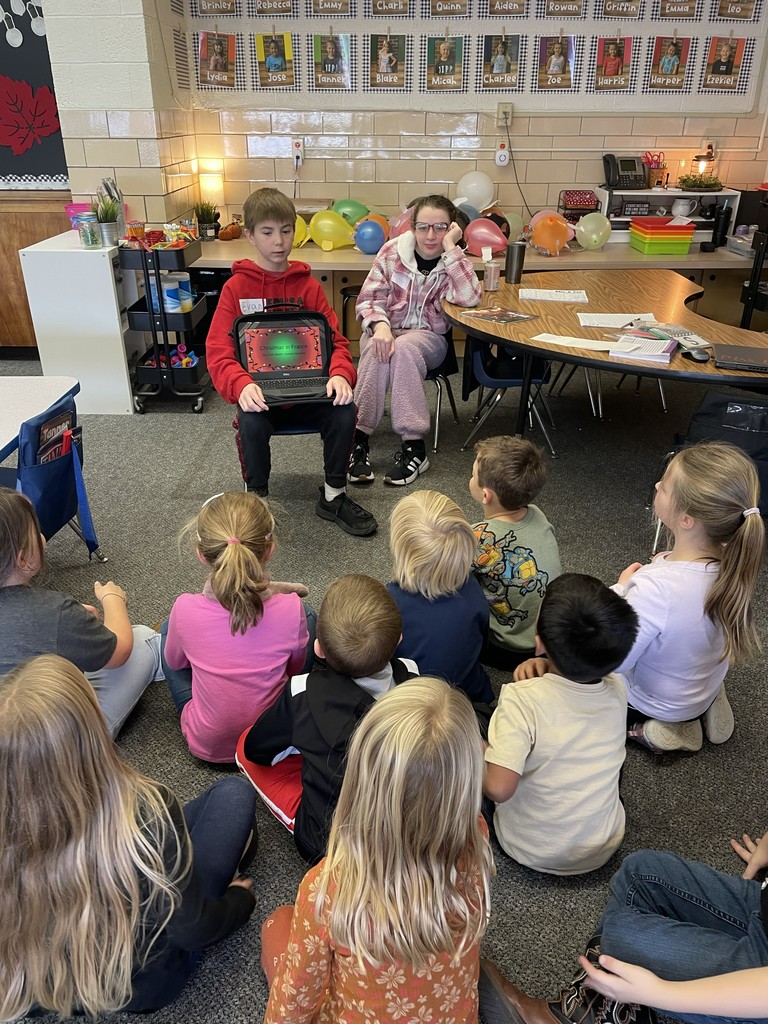 TMS 8th graders work with kindergarten students to learn about holiday traditions around the world. 