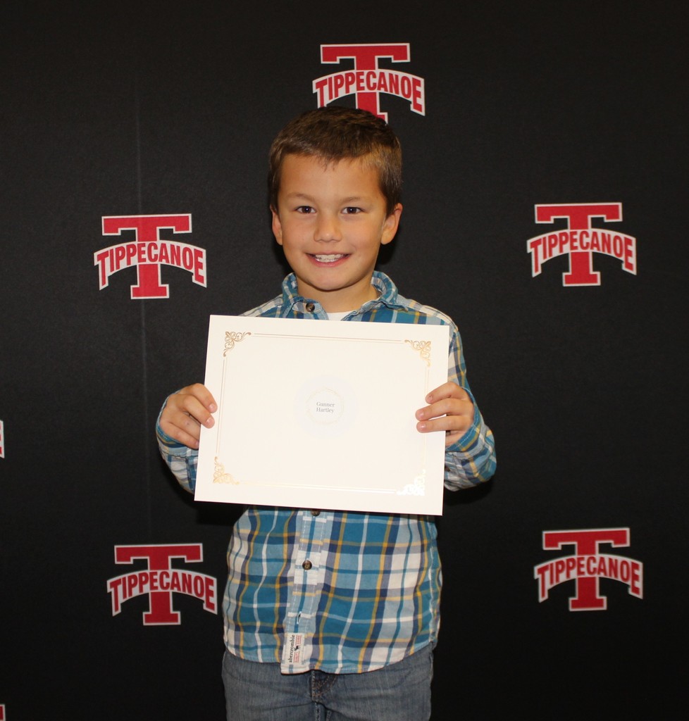 Student honored at BOE for random act of kindness. 