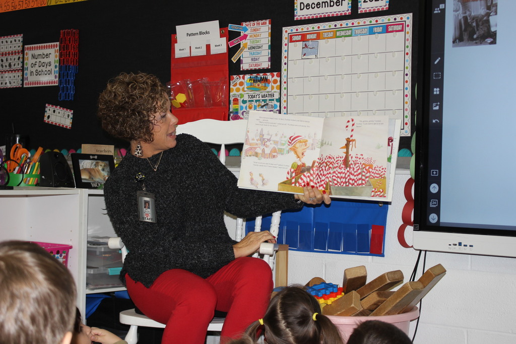 Broadway principal reading to students. 