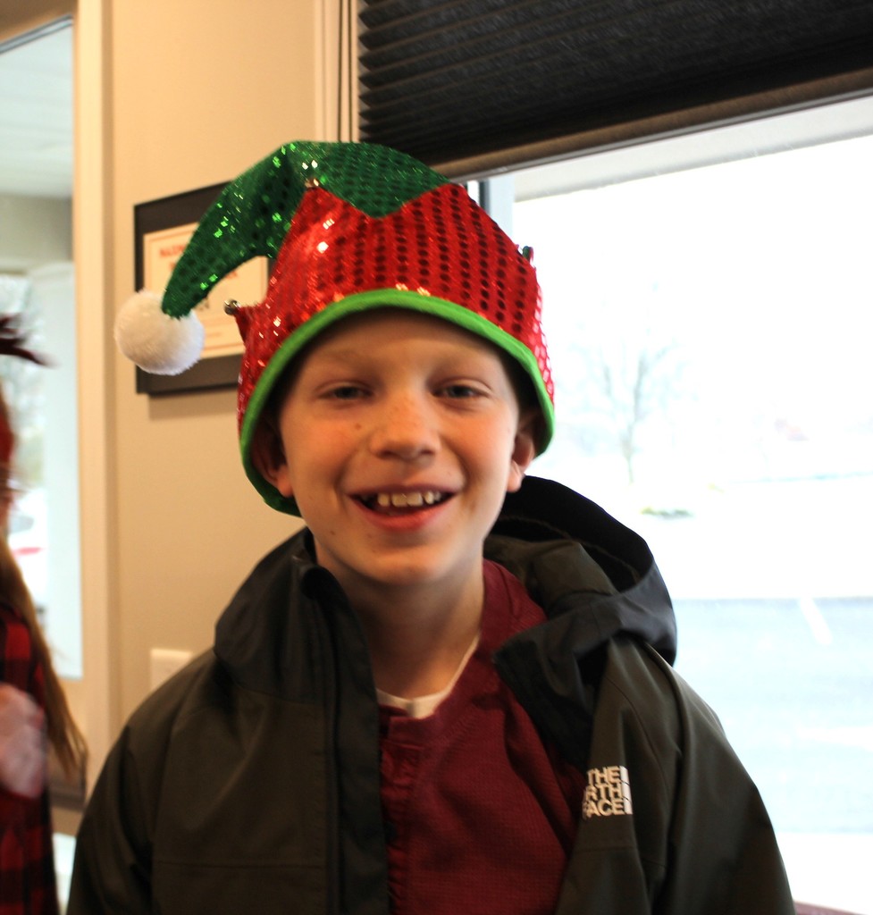 L.T. Ball 5th graders sang some holiday music for members of the Tipp Senior Center and a student poses before heading back to campus.  