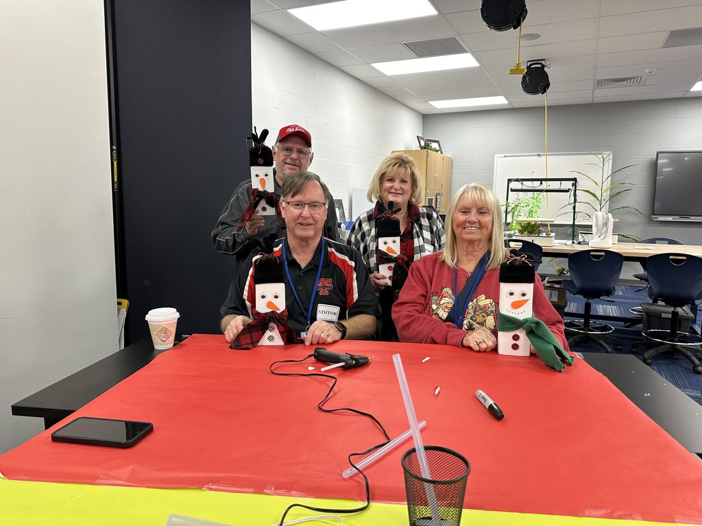 Bus drivers and chaperones at MVCTC show off their handy work.