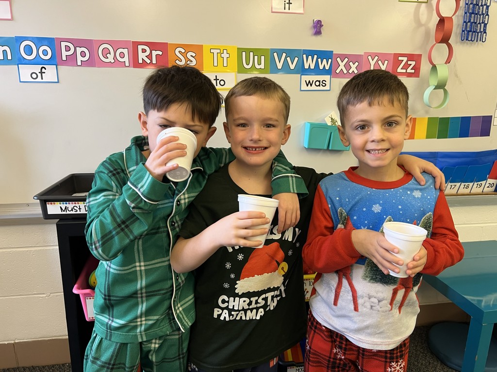 Mr. G the conductor from Polar Express deliver hot chocolate to kindergarten students.