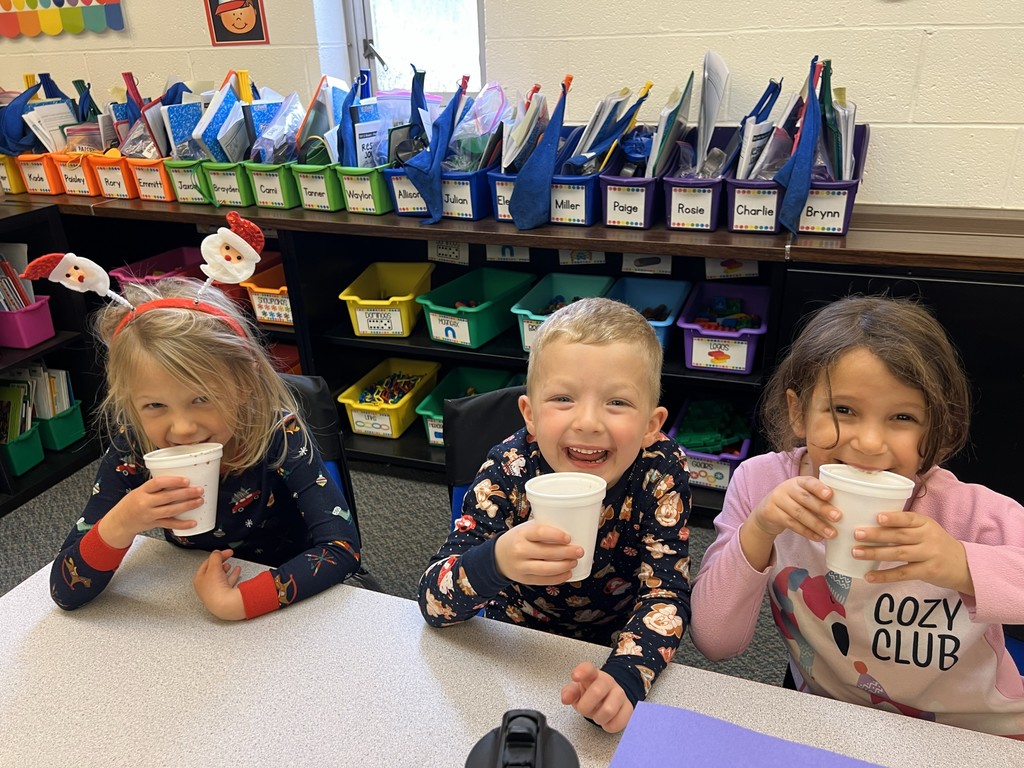 Mr. G the conductor from Polar Express deliver hot chocolate to kindergarten students.