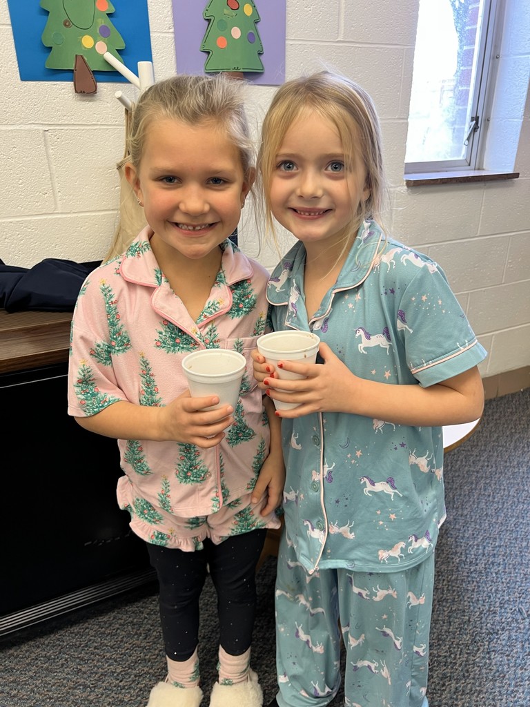 Mr. G the conductor from Polar Express deliver hot chocolate to kindergarten students.