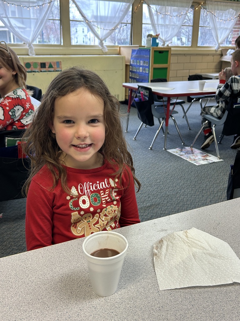 Mr. G the conductor from Polar Express deliver hot chocolate to kindergarten students.