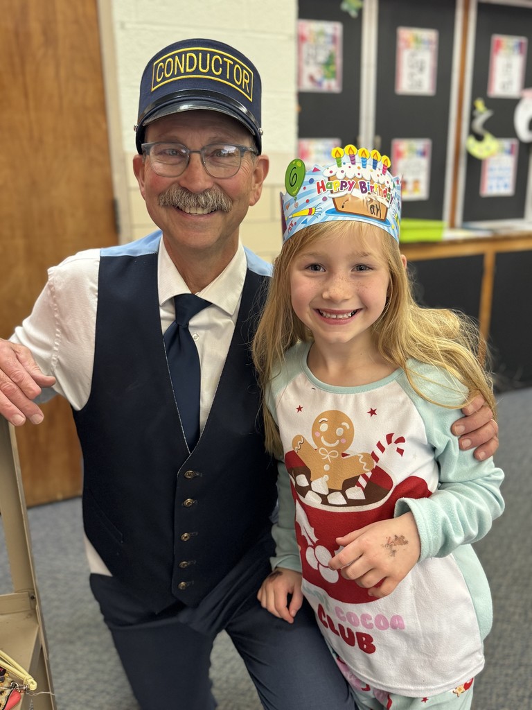 Mr. G the conductor from Polar Express deliver hot chocolate to kindergarten students.