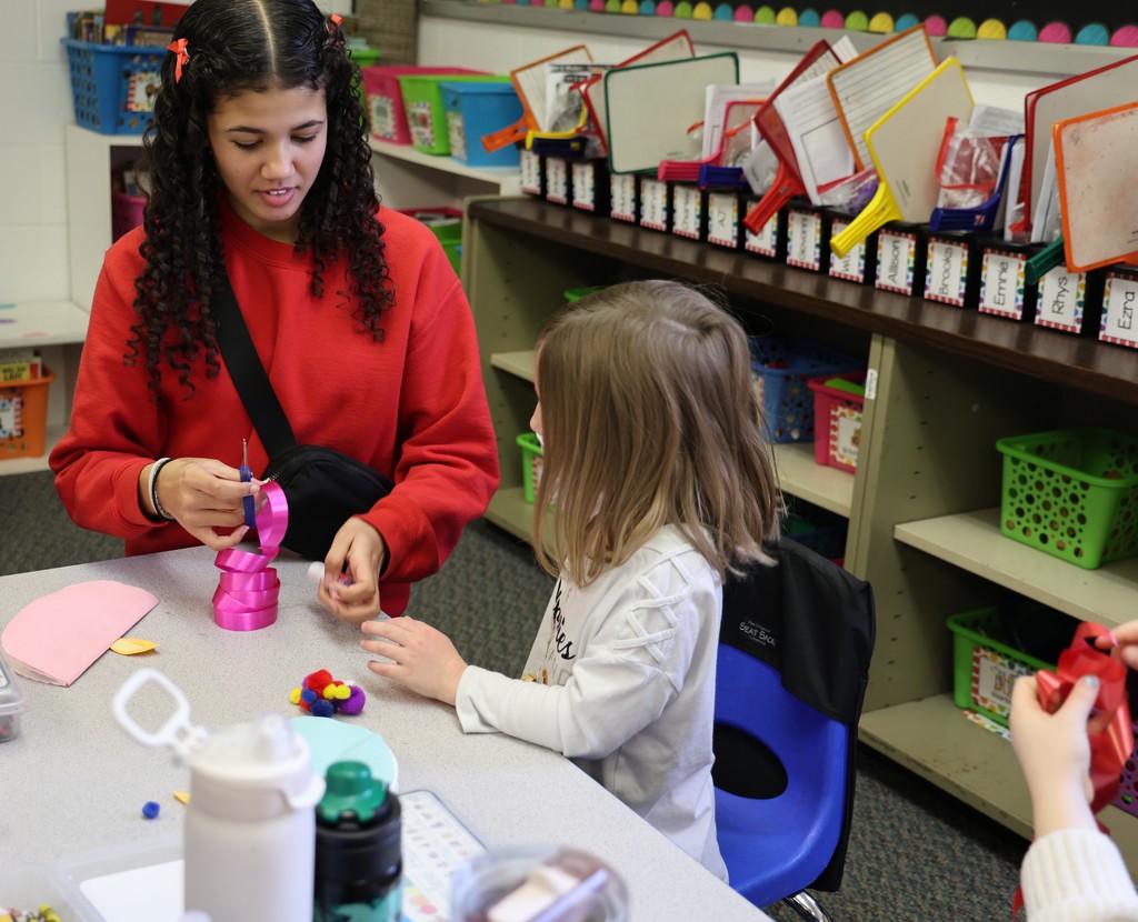TMS Designing Thinking students work with kindergarten students on holiday projects.    