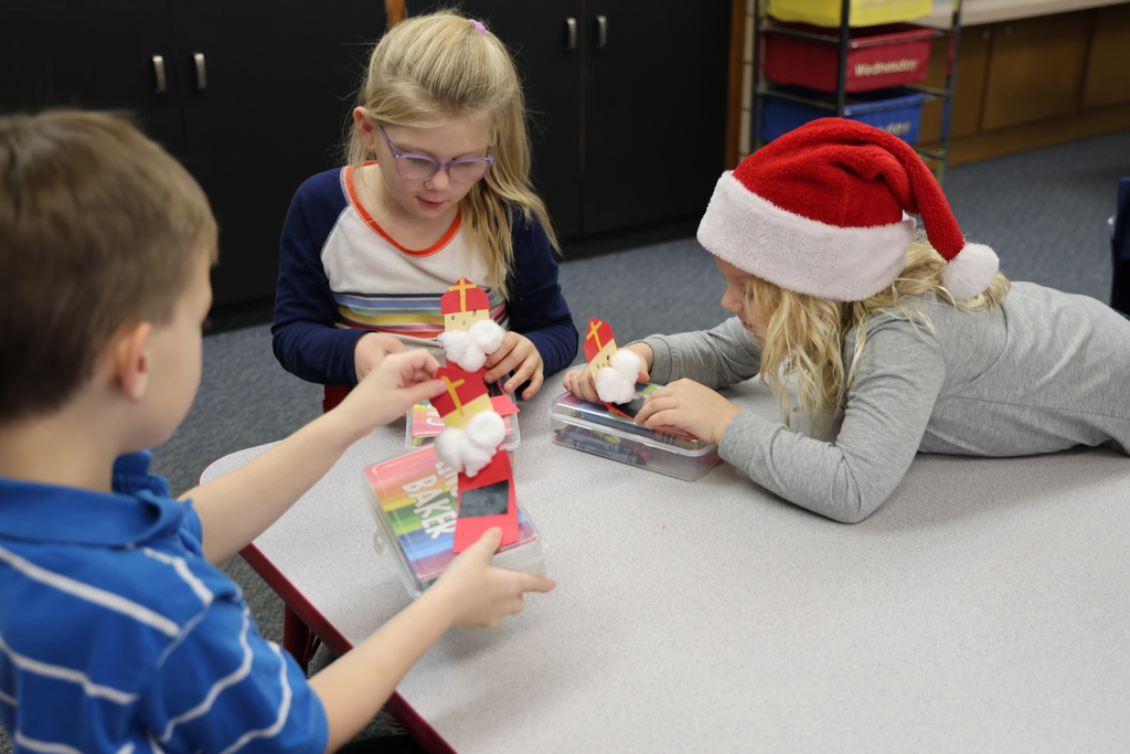 TMS Designing Thinking students work with kindergarten students on holiday projects.    