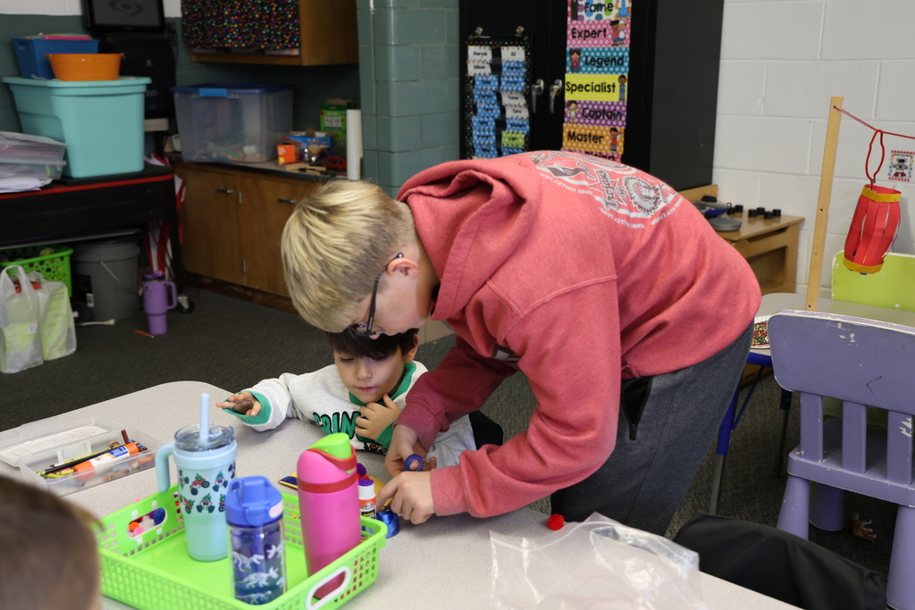 TMS Designing Thinking students work with kindergarten students on holiday projects.    