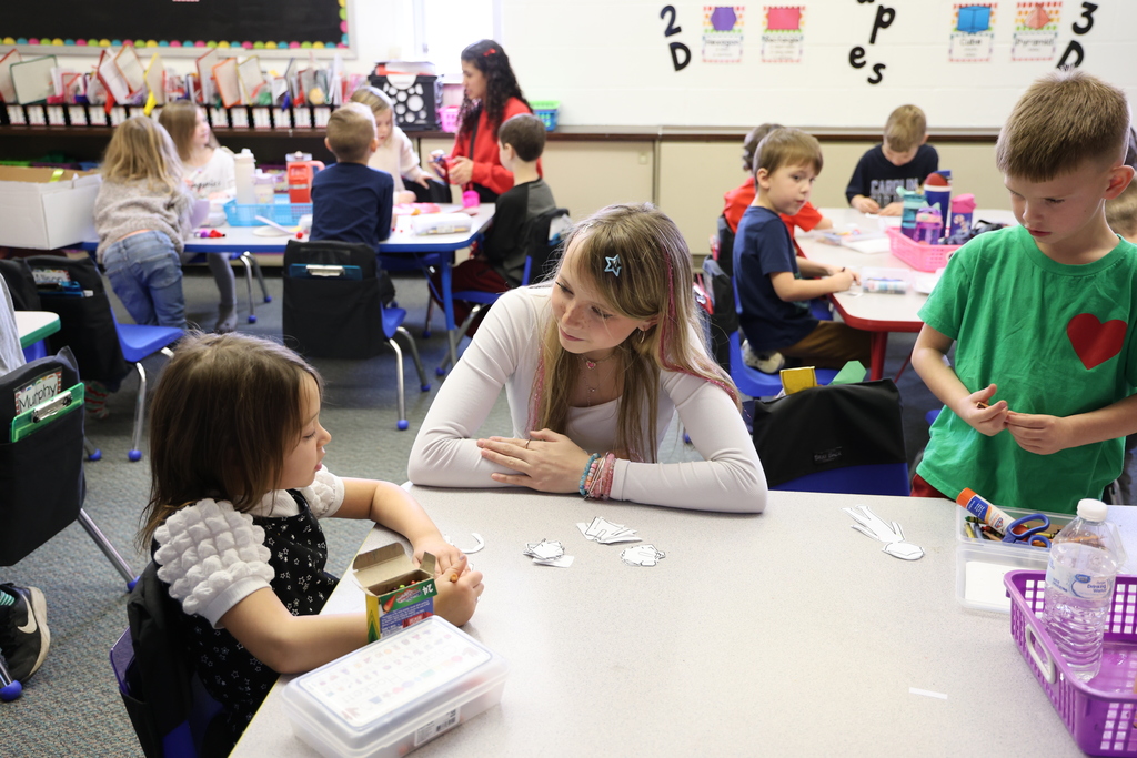 TMS Designing Thinking students work with kindergarten students on holiday projects.    