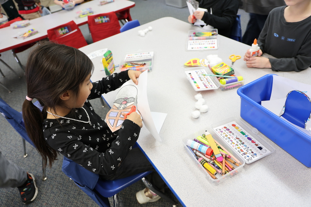 TMS Designing Thinking students work with kindergarten students on holiday projects.    