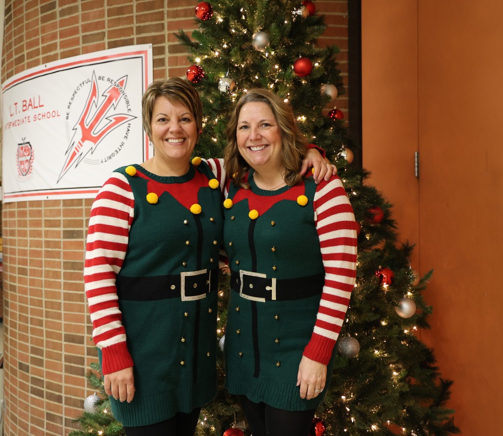L.T. Ball teachers are twinning it on Ugly Sweater Day.  Same sweater 15 years later.