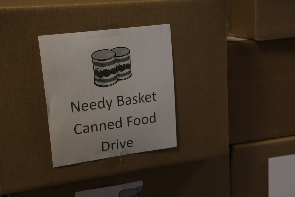 Needy Basket Canned food drive sign and box.