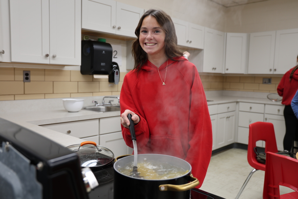 TMS students preparing lasagna for St. Vincent de Paul.