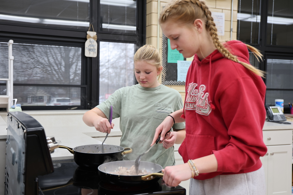 TMS students preparing lasagna for St. Vincent de Paul.