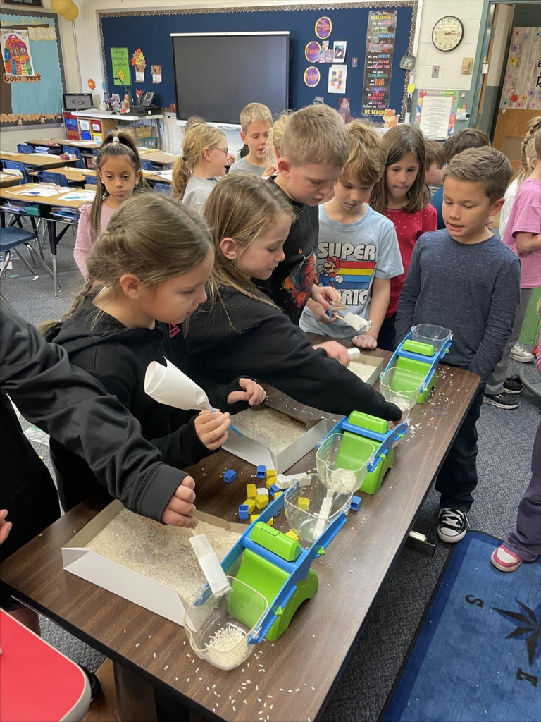 Second graders team up for a STEM activity.  
