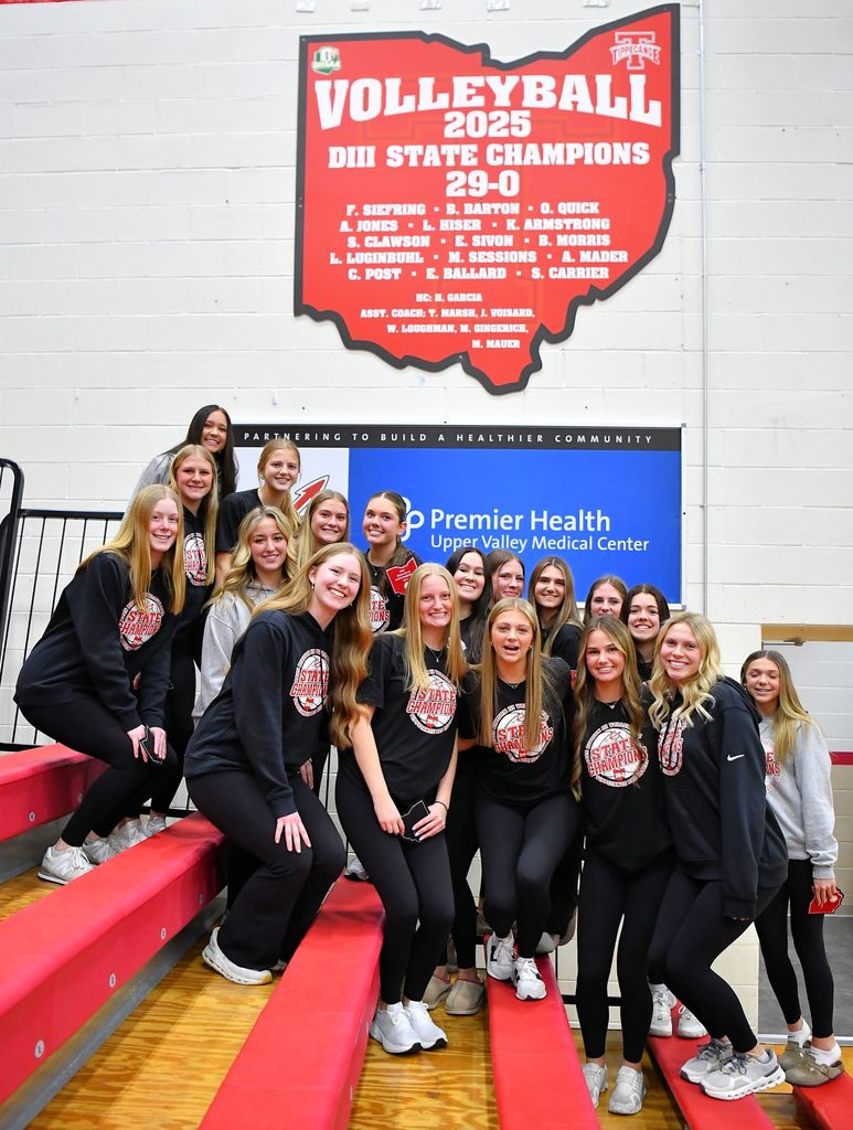 The THS volleyball team pose for a photo.