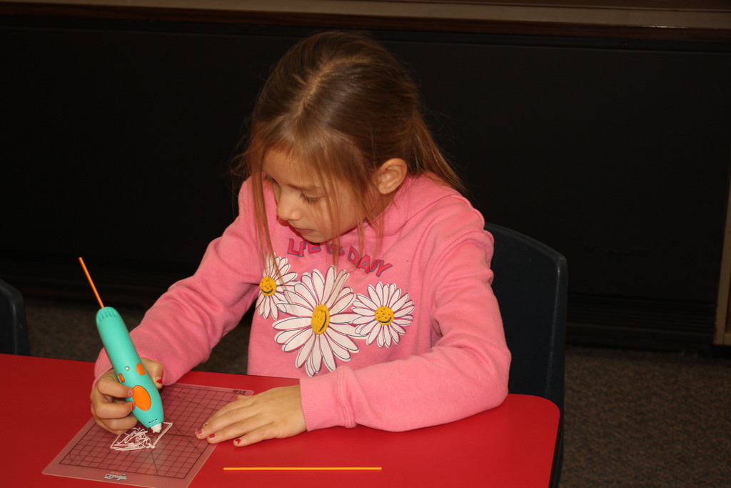 A Broadway student works with a 3D Pen.  