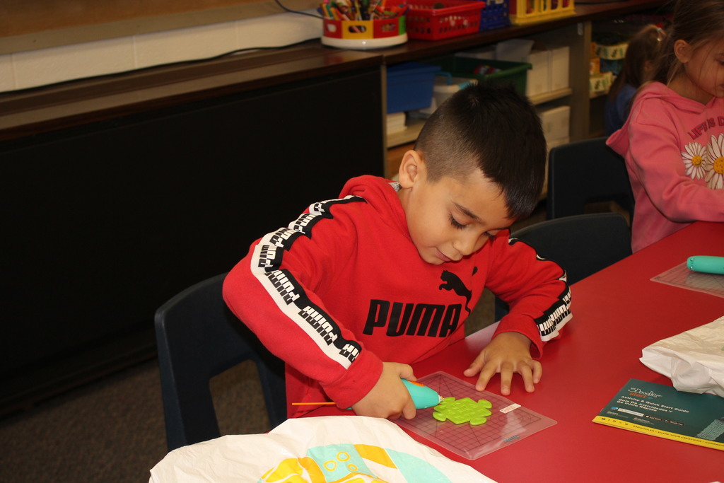 A Broadway student works with a 3D Pen.  