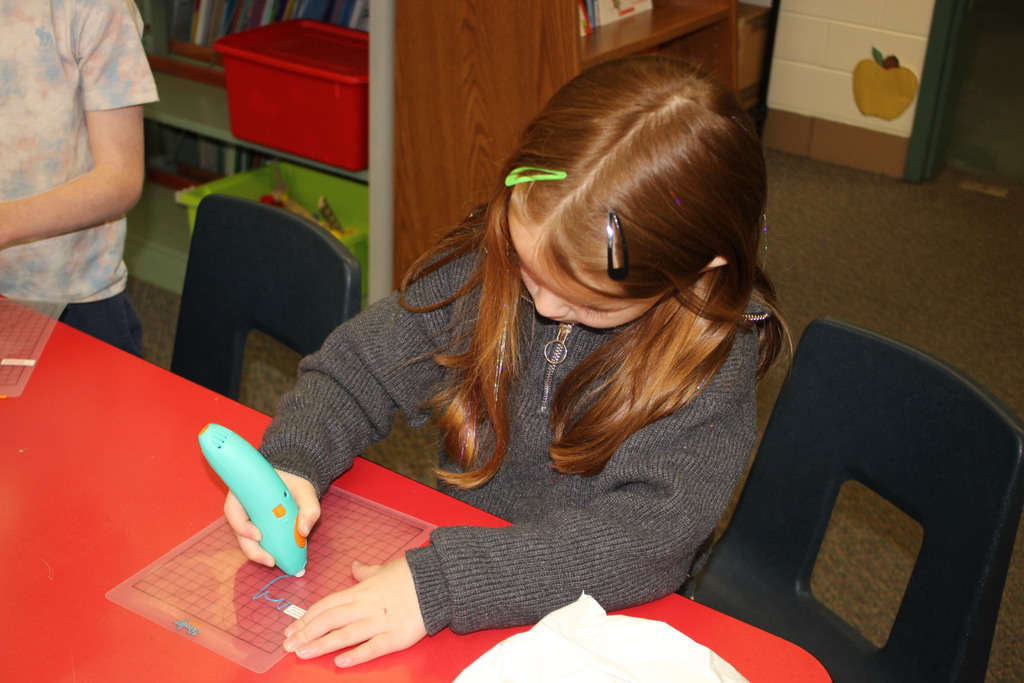 A Broadway student works with a 3D Pen.  