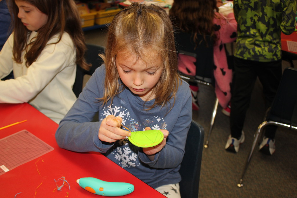 A Broadway student works with a 3D Pen.  
