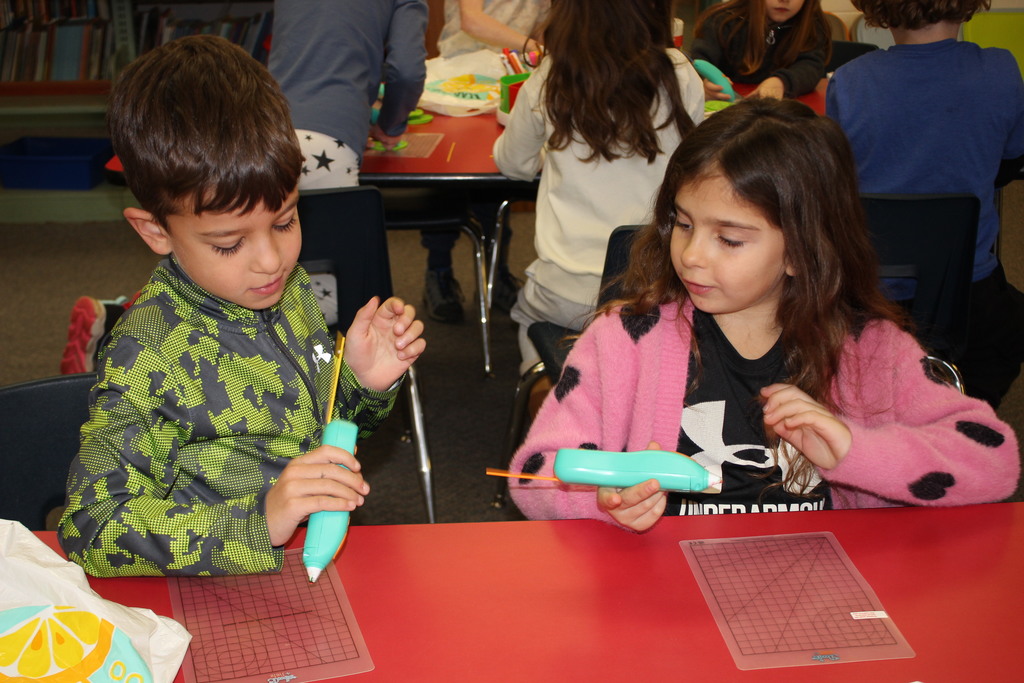 A Broadway student works with a 3D Pen.  
