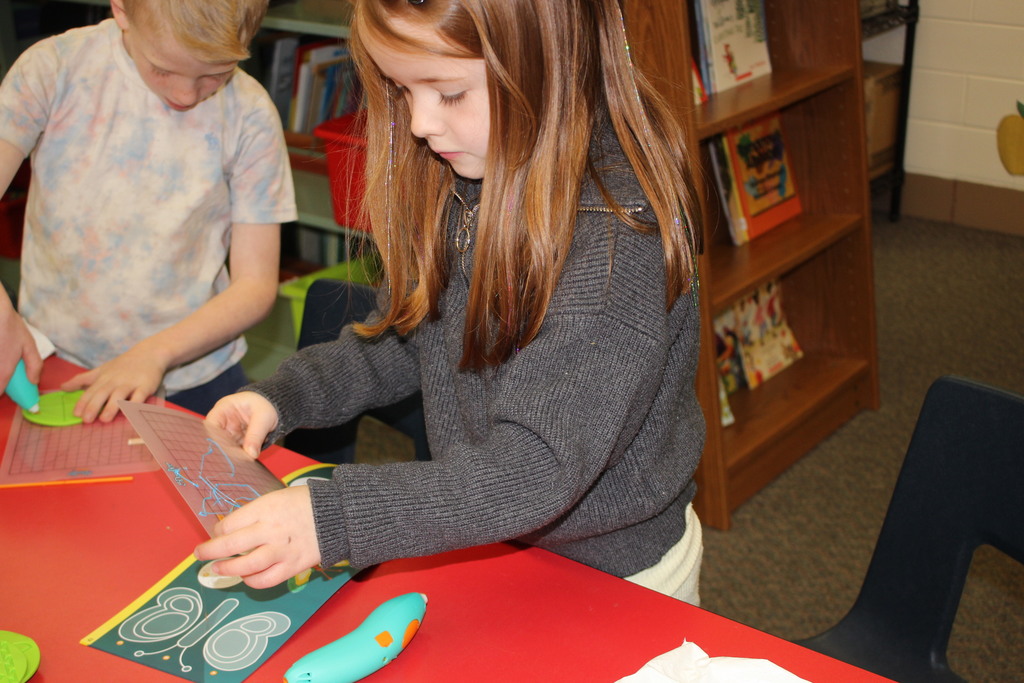 A Broadway student works with a 3D Pen.  