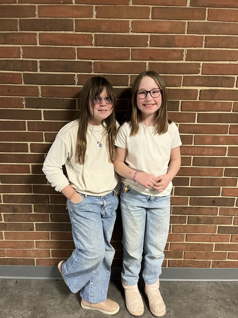 Two L.T. Ball girls in matching outfits head to toe for Twin Day.