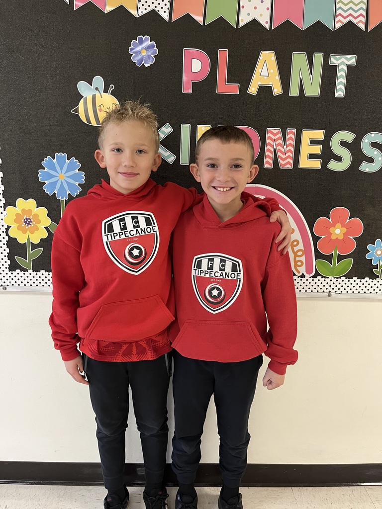 Two boys in red team sweatshirts and black sweats for Twin Day at LT Ball.