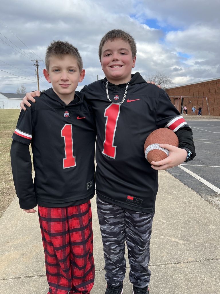 Two boys in matching football jerseys for Twin Day at L.T. Ball.