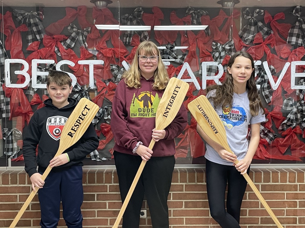 Tippecanoe Middle School Crew of the Week recipients with the oars representing PBIS.