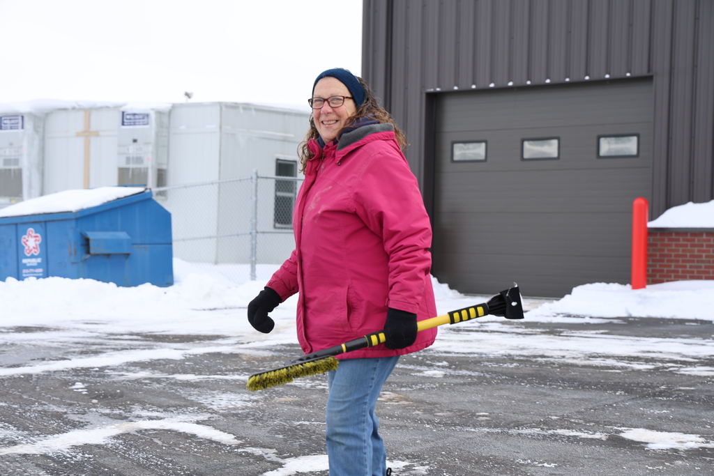 One of our bus drivers gets ready to help clear snow.  